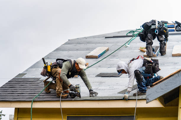 Professional Gutter Installation technician working in Fitchburg, MA